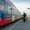 Cyclist boarding a train